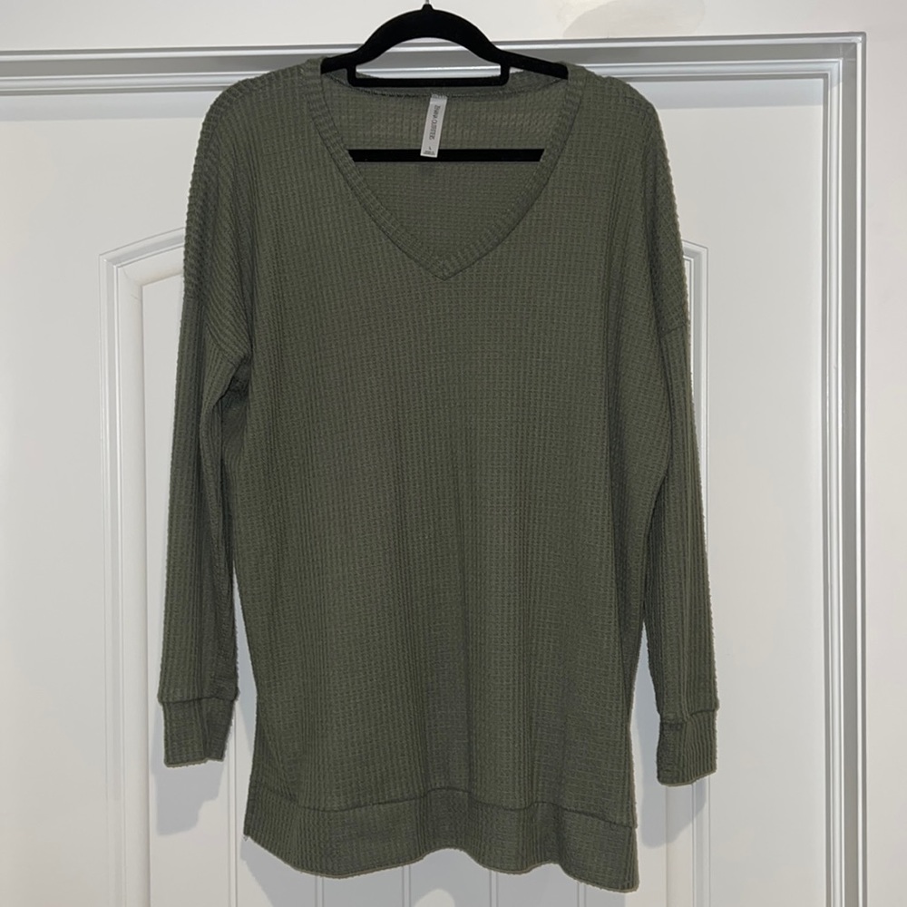 Local boutique, olive green waffle sweater. Very cozy.